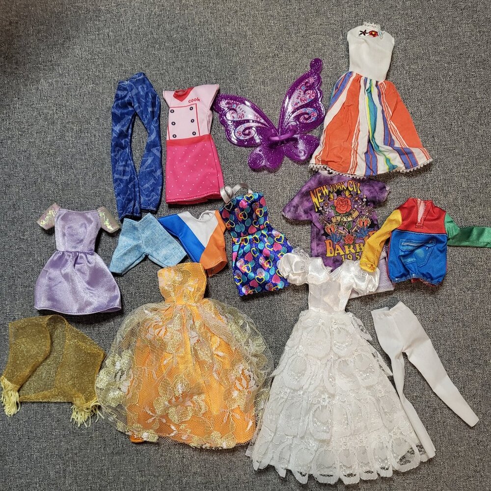 Assorted Barbie clothes. Dresses, outfits, accessories